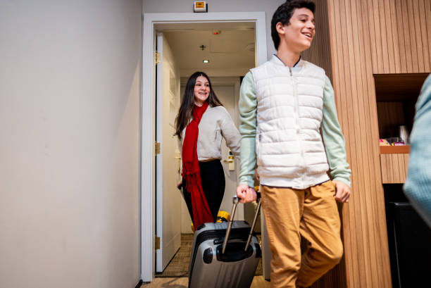 istock Siblings arriving at hotel room 2179988395