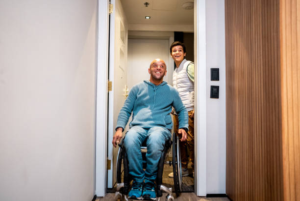 istock Father and son arriving at hotel room 2179988456