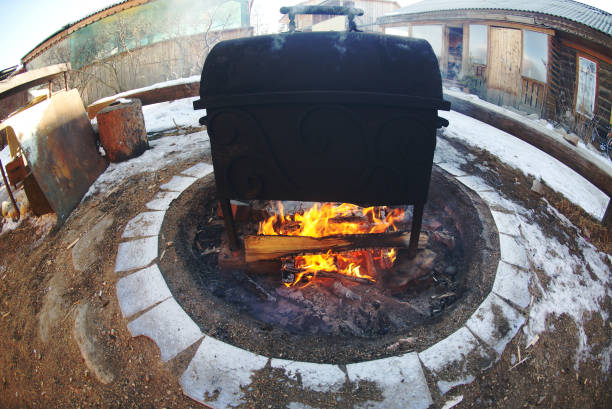 An oven used to steam fish while the fire is blazing.