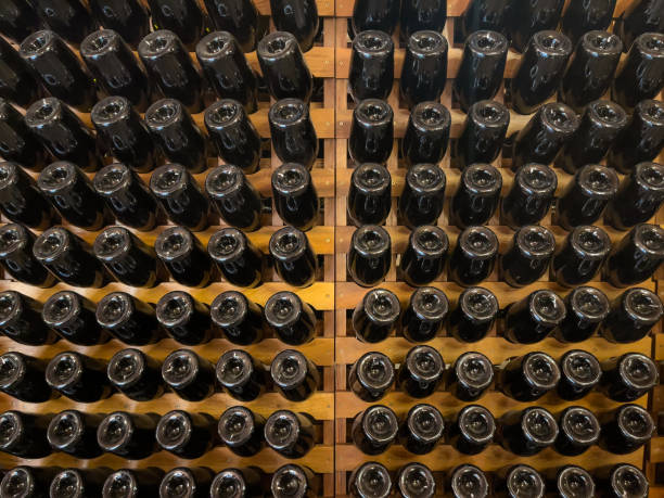 istock Wine bottles stored upside down in a wooden cellar. 2179993345