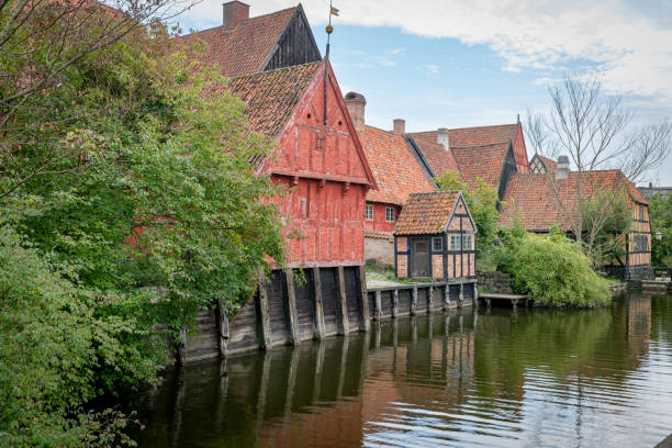 istock Historic Danish Timber-Framed Houses by Tranquil River in aalborg denmark 2179994378