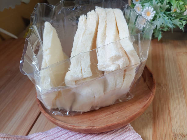 istock Close up of sliced ​​messy white plain bread put into plastic 2179997023