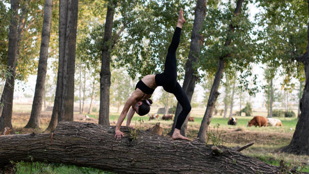 istock Woman doing yoga exercise in nature 2179997039