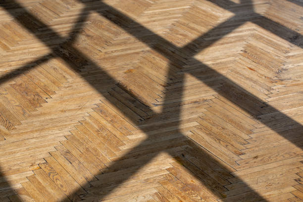 istock Abstract background with straight shadows on old wooden parquet. 2179999319