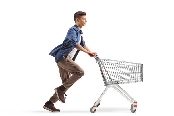 istock Guy running with an empty shopping cart 2180001055