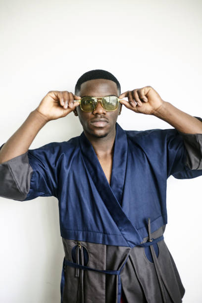 istock Striking fashionista posing for camera in studio 2180002976
