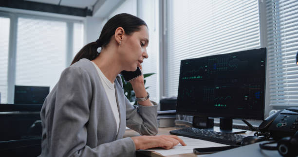 istock Female financial analyst discusses strategy of project using mobile phone 2180003522