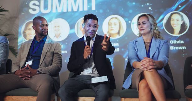 istock Conference, seminar and keynote speaker with business people and technology for networking, industry panel and summit. Convention, stage and ai ethics with speech for audience, event showcase or news 2180004869