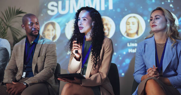 Conference, microphone and keynote speaker with business woman and technology for networking, industry panel and summit. Convention, stage and ai ethics with seminar for audience, showcase or news
