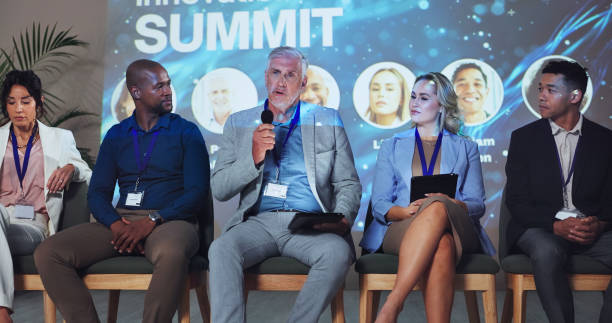 istock Stage, seminar and tradeshow with business people and technology for networking, industry panel and keynote speaker. Hackathon, summit and ai ethics with speech for audience, event showcase and news 2180004940