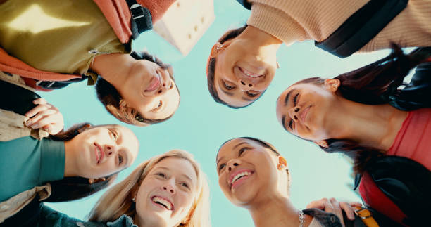 istock Students, team and education with friends from low angle for learning, college and studying knowledge. University, support and community with group of people for school, diversity and future 2180005220