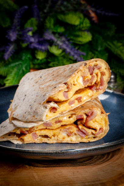 istock Tortilla multigrain with omelette, sausage and bacon. 2180005362