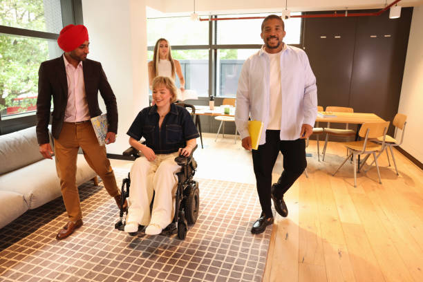istock Diverse group of business people walking through office 2180006002