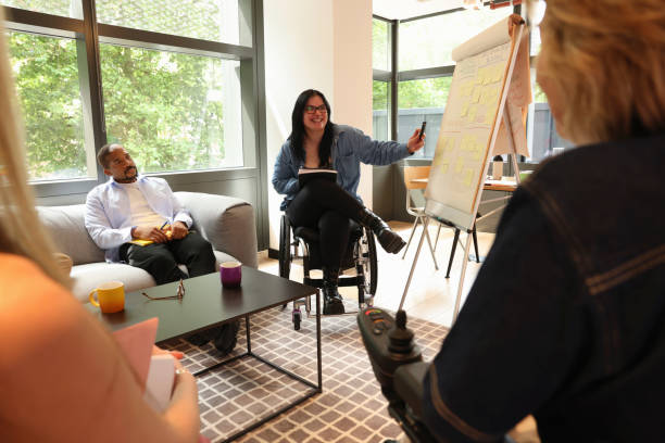 istock Diverse group of business people during presentation in office 2180006702