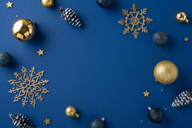 istock Explore elegant Christmas decorations on a deep blue background, featuring golden snowflakes, ornaments, and stars. Perfect for crafting holiday ambiance and seasonal celebrations 2180007634