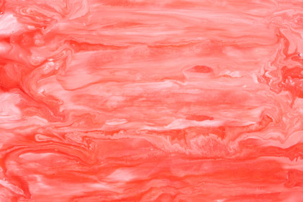 istock Abstract background mixing red and white paints. 2180012027