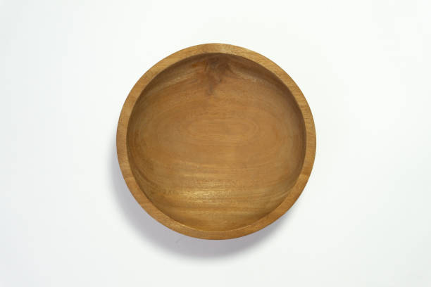 istock Wooden bowl isolated on white background with a top angle setup. 2180012393