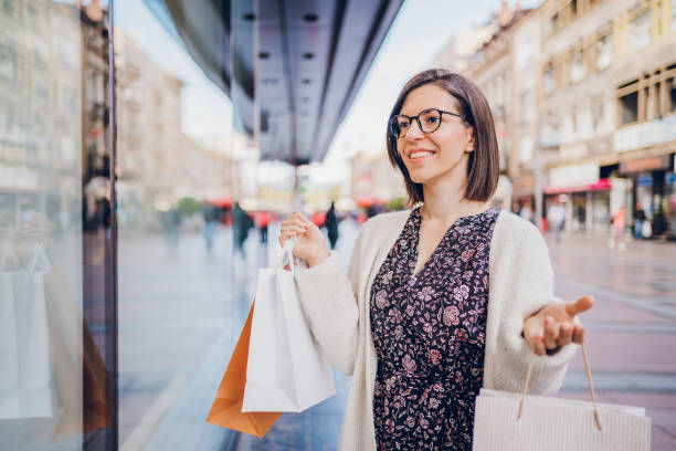 istock Woman enjoying in shopping 2180012446