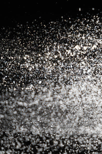 istock Abstract black and white background of pouring flour, space for text 2180012821