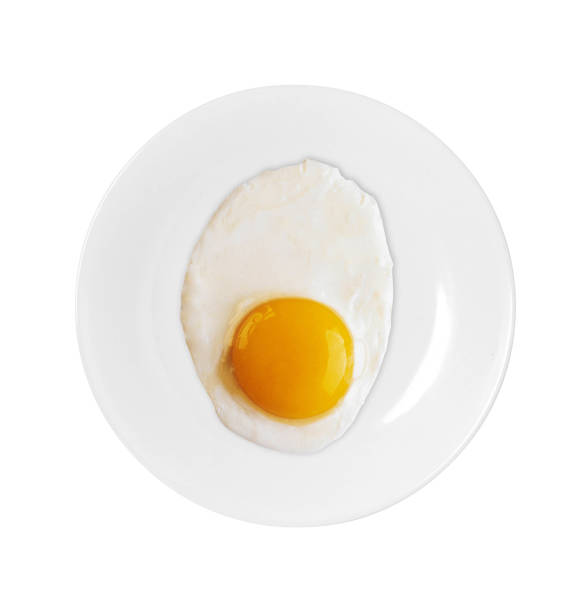 istock Top view of white dish with fried egg 2180016790