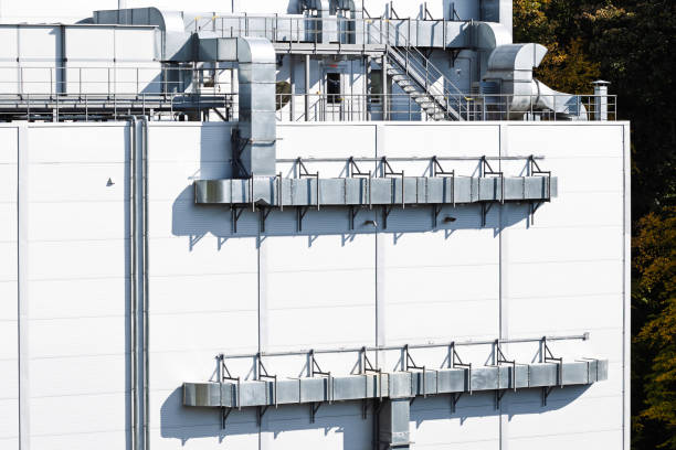 istock factory building external facade construction with pipes and circulation elements and metal frame objects perspective industrial background 2180018608