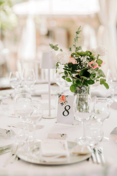 istock Table setting for an event party or wedding reception. Fresh flower table decoration 2180024266