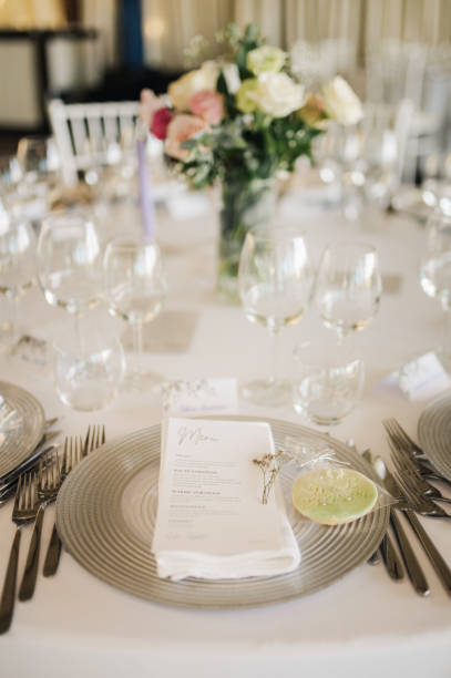istock Table setting for an event party or wedding reception. Fresh flower table decoration 2180024270