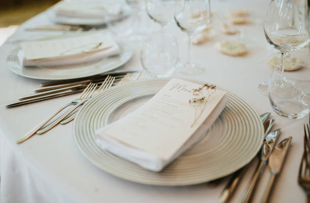 istock Table setting for an event party or wedding reception. Fresh flower table decoration 2180024274