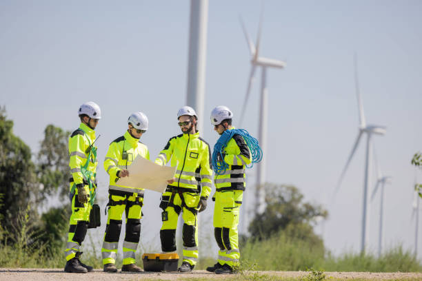 istock Engineers are having a discussion at wind turbine field 2180027954