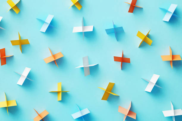 Colorful plus signs on blue background. Horizontal composition with copy space.