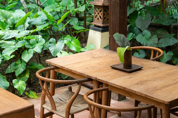 istock Serene Outdoor Dining Area Surrounded by Greenery 2180032121