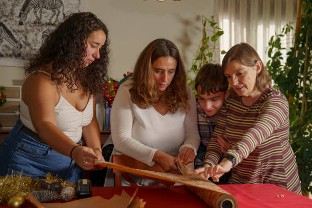 istock Family Gift Wrapping for the Holidays 2180033350