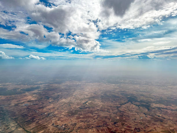 Aerial view of Requena fields mist in Valencia of Spain Aerial view of Requena fields vanishing in the mist under dramatic sky in Valencia of Spain aircraft point of view stock pictures, royalty-free photos & images