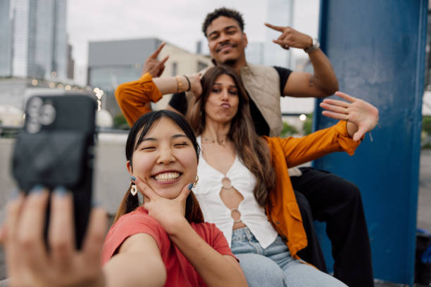 istock Three happy friends spending time together 2180039259