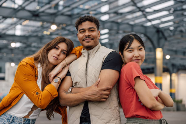istock Three happy friends posing together to camera 2180039977