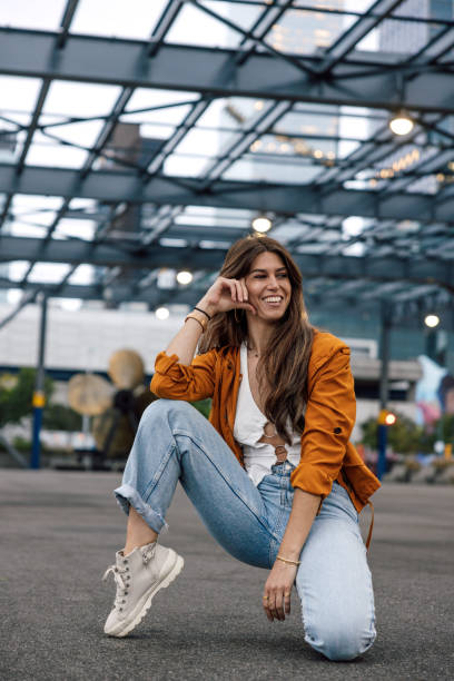 istock Spanish woman in casual outfit posing looking at camera 2180040712