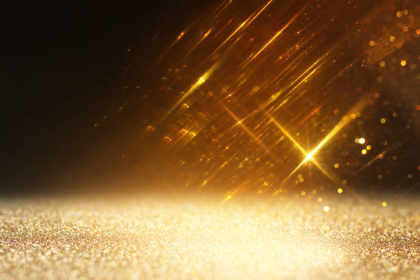 istock abstract glitter black and gold lights background. de-focused 2180041719