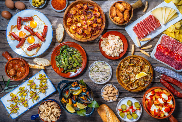 Assorted Tapas from Spain food, typical Spanish recipes, and pintxos on a rustic wood