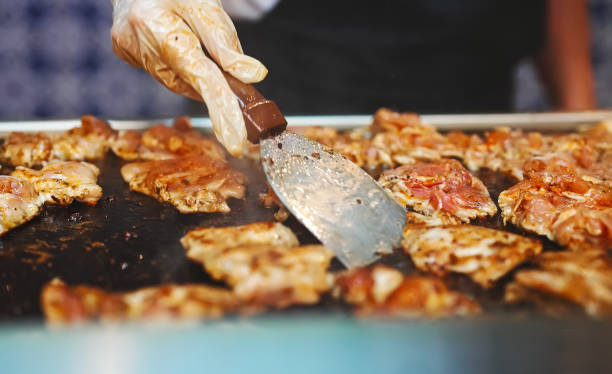 istock Lots of fried chicken thighs grilled. 2180045669