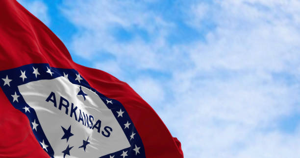 istock Arkansas state flag waving in the wind on a clear day 2180048761