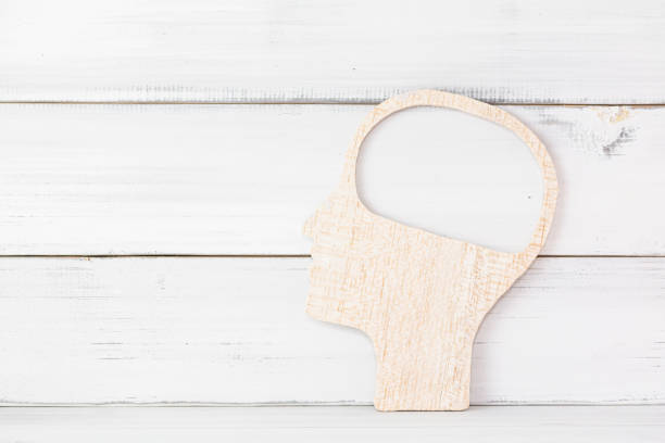 Abstract Wooden Silhouette of a Head with Open Mind Concept on White Background