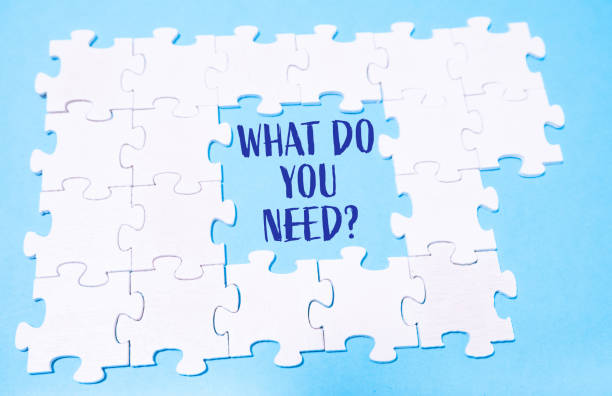 istock Puzzle pieces with What do you need text on a blue background 2180052797
