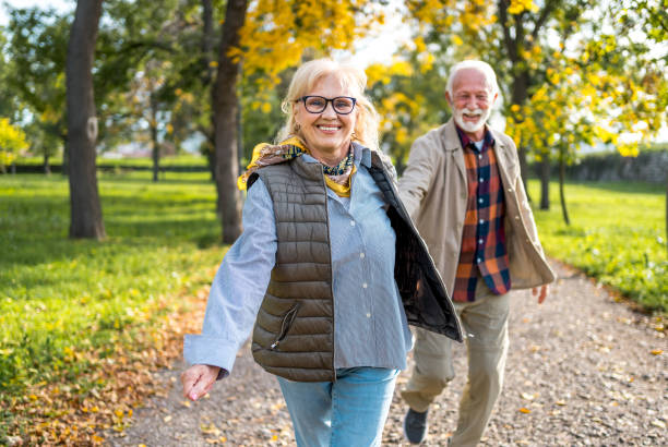 istock Senior couple enjoying autumn walk 2180054714