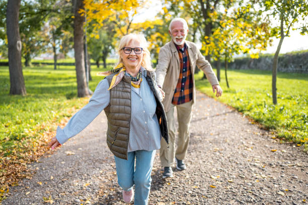 istock Joyful senior couple at the park 2180056002