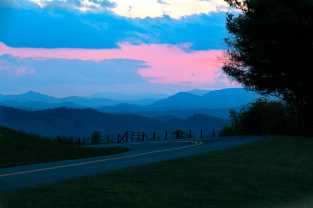 istock Serene mountain landscape at dusk with vibrant sunset colors 2180056510
