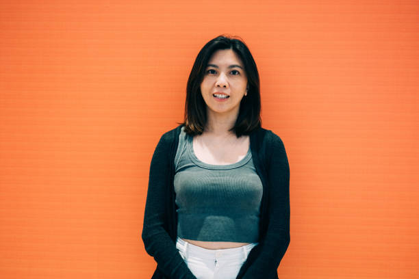 istock Vibrant Palette: A Stunning Asian Woman Amidst Bold Colors 2180058854