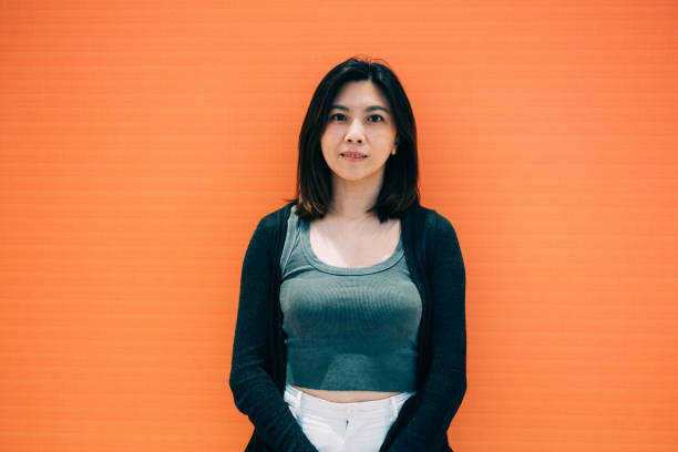 istock Graceful in Color: A Beautiful Asian Woman's Captivating Aura 2180058856