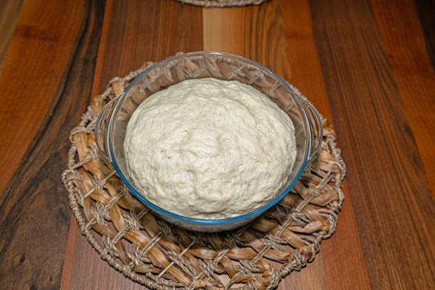 istock Kneaded and fermented dough in a bowl. 2180062135
