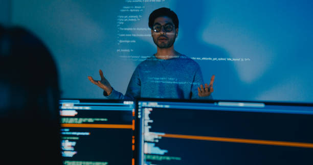 istock Group Asia male software developers mentor leader manager talk strategy plan to executive write prompt AI bot IT app program nomad, video game, designer, data center. Projecting slideshow code. 2180062179