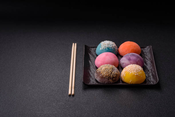 istock Delicious colorful asian mochi sweets with rice dough shell and fruit filling 2180063733